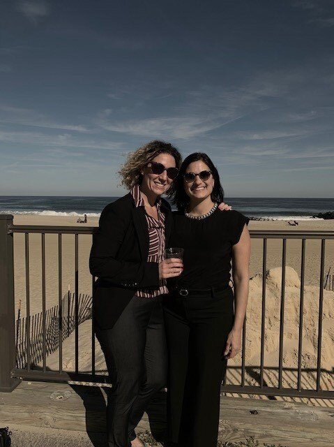 Rosanna and Filomena smiling on a beach front.